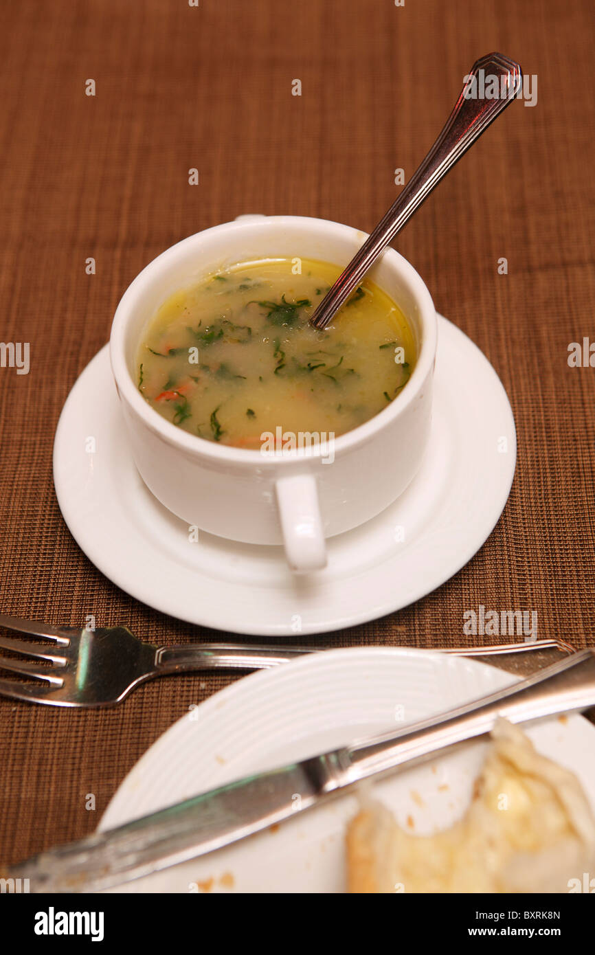 Portuguese caldo verde soup (green soup with chorizo sausage) served in a restaurant in Macau Stock Photo