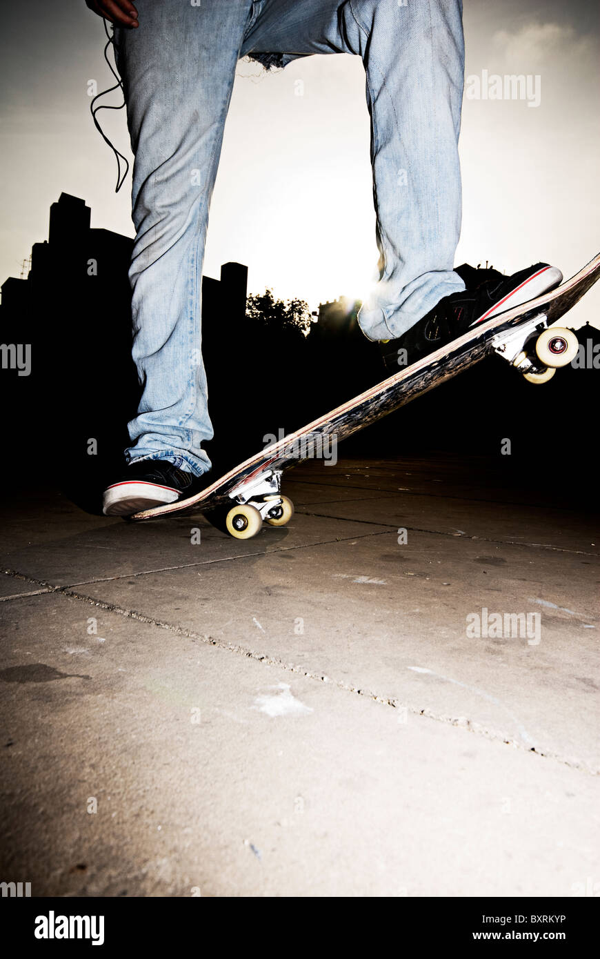 young skateboarder, just stand up with hard backlighting at barcelona, paradise of skate Stock Photo