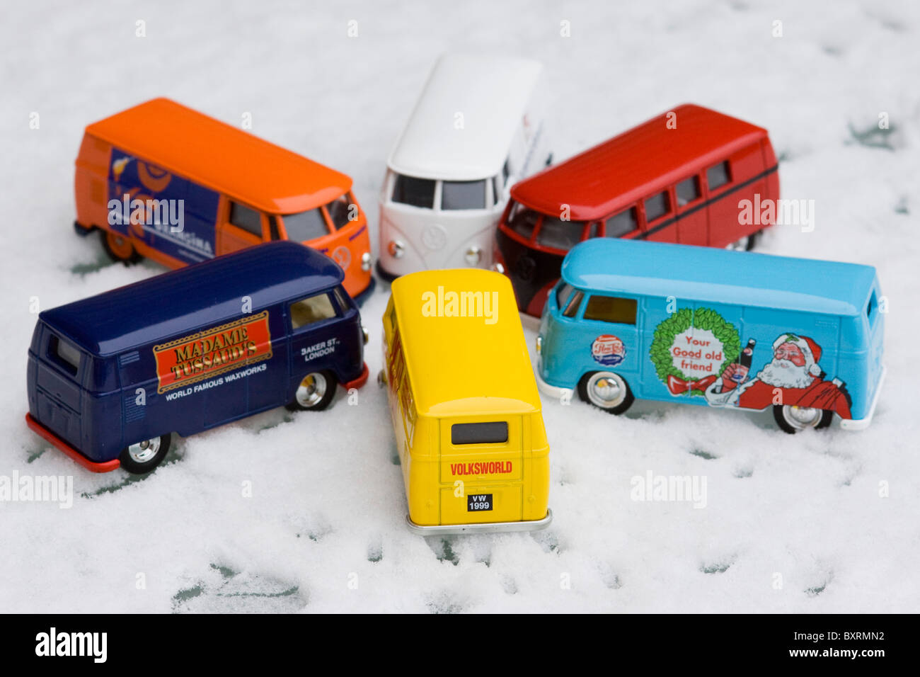 Children's collectible toy models of  Volkswagen split screen panel vans on Snow Stock Photo