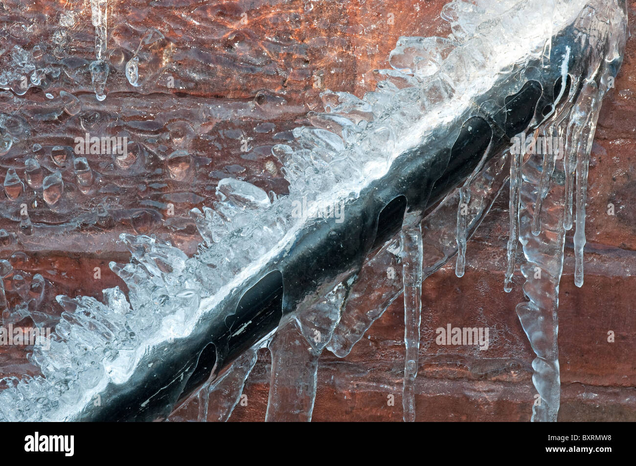 Frozen waste pipe, caused by a burst outside tap Stock Photo Alamy