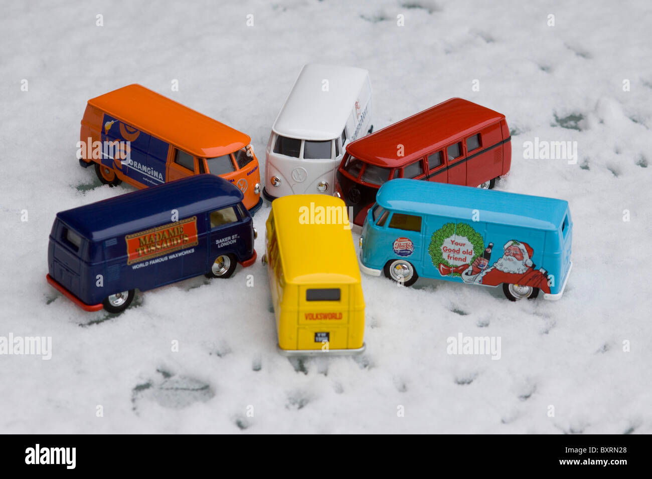 Children's collectible toy models of  Volkswagen split screen panel vans on Snow Stock Photo