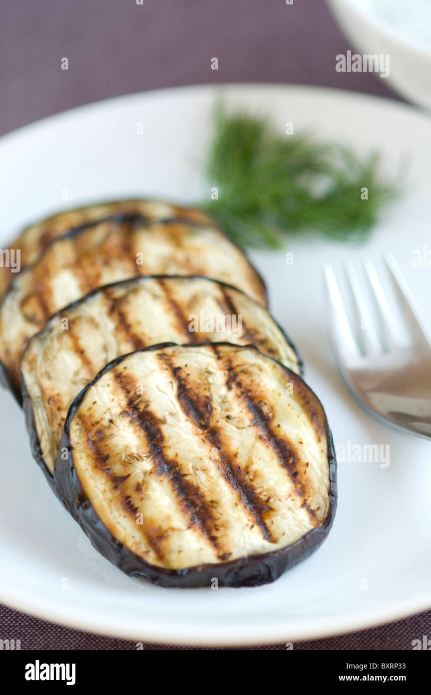 Sliced aubergine grilled with sauce Stock Photo