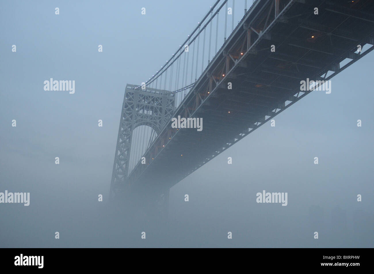 The George Washington Bridge, which spans the Hudson River between New York and New Jersey, in dense fog. Jan. 2, 2011 Stock Photo