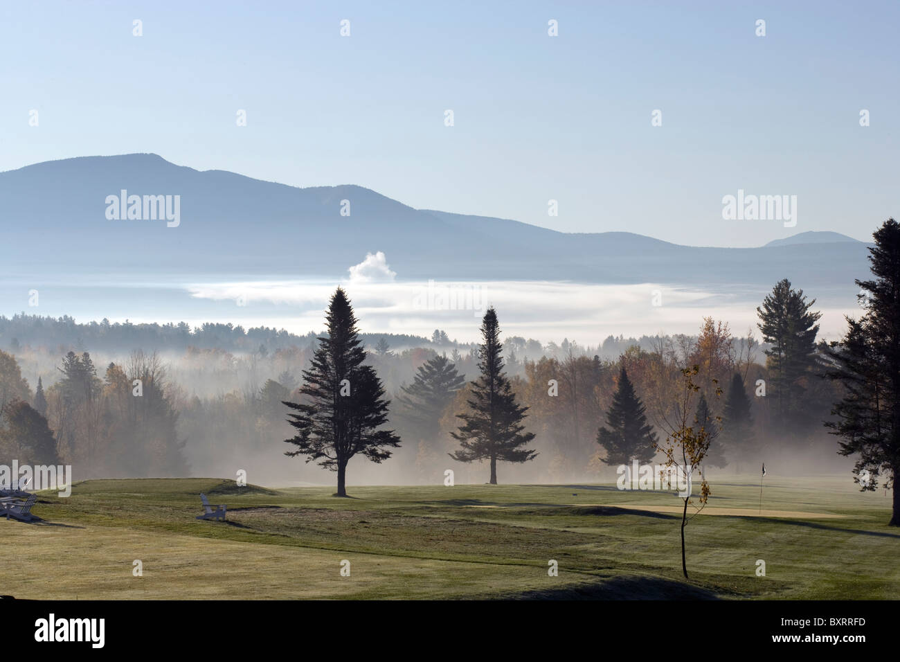 New Hampshire, White Mountains, View of landscape with mountains and fog at dawn Stock Photo