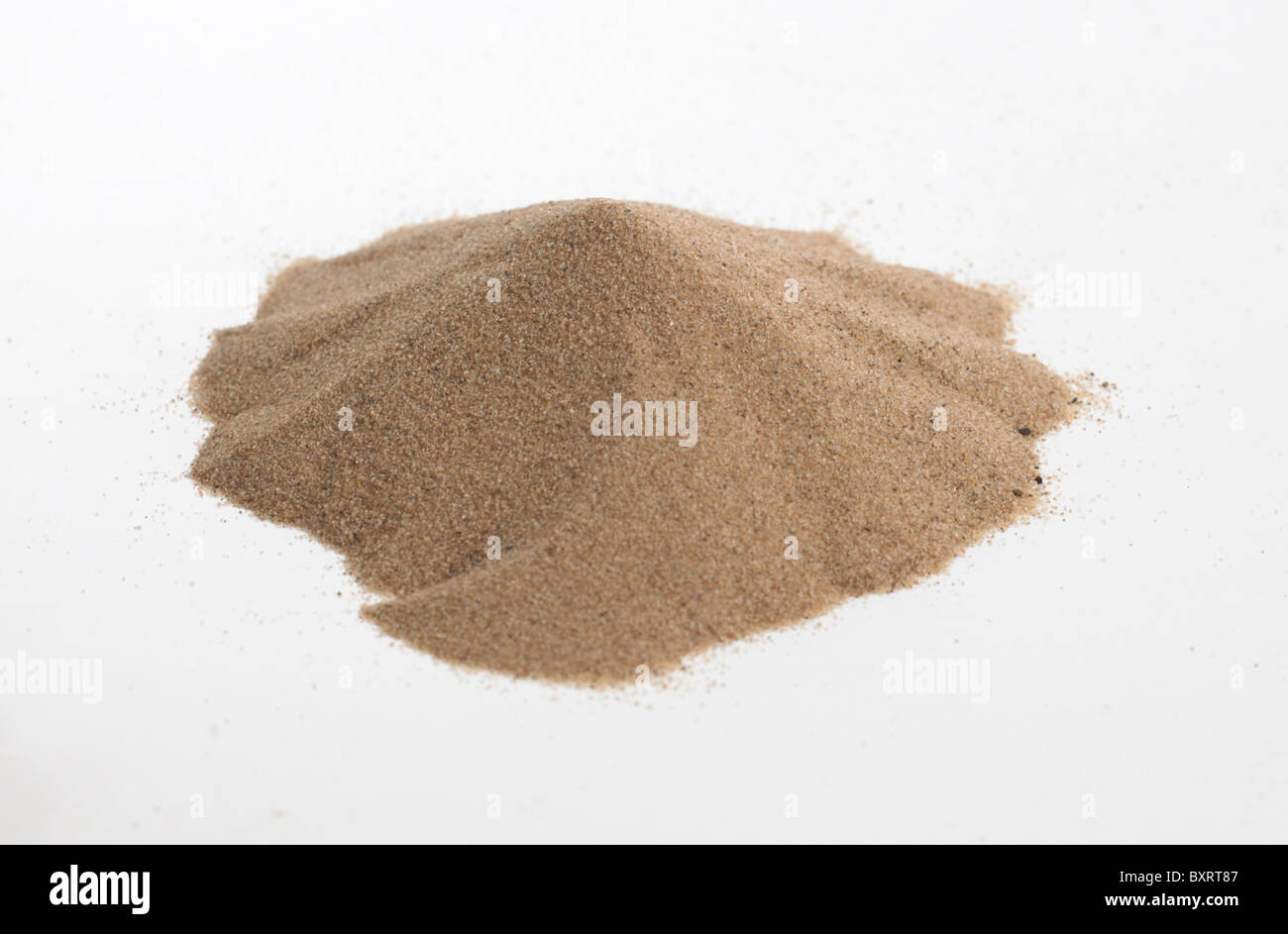 Pile of sand on white background Stock Photo