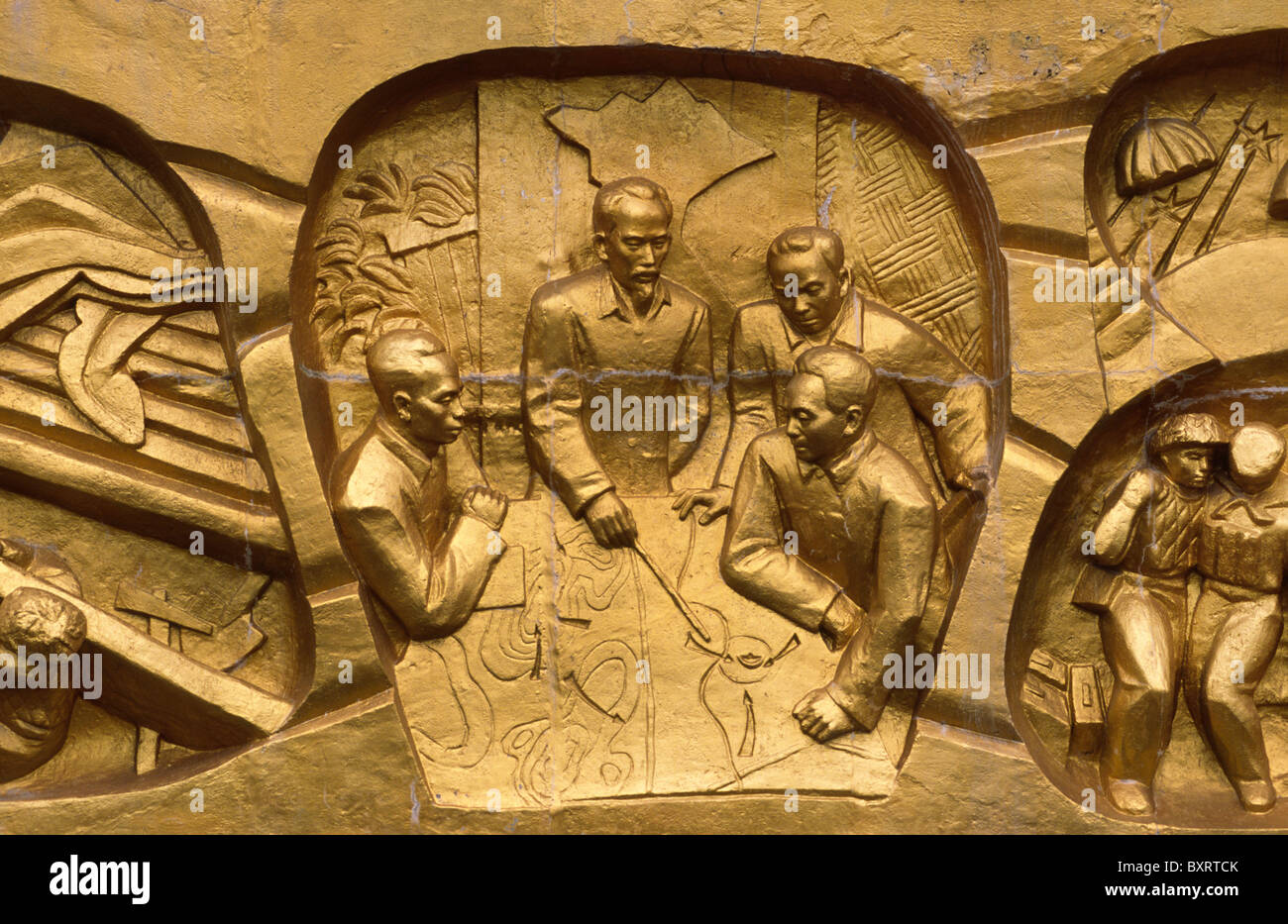 Reliefs with  the scenes from the Battle of Dien Bien Phu at war cemetery; Ho Chi Min and his generals planning the battle. Stock Photo