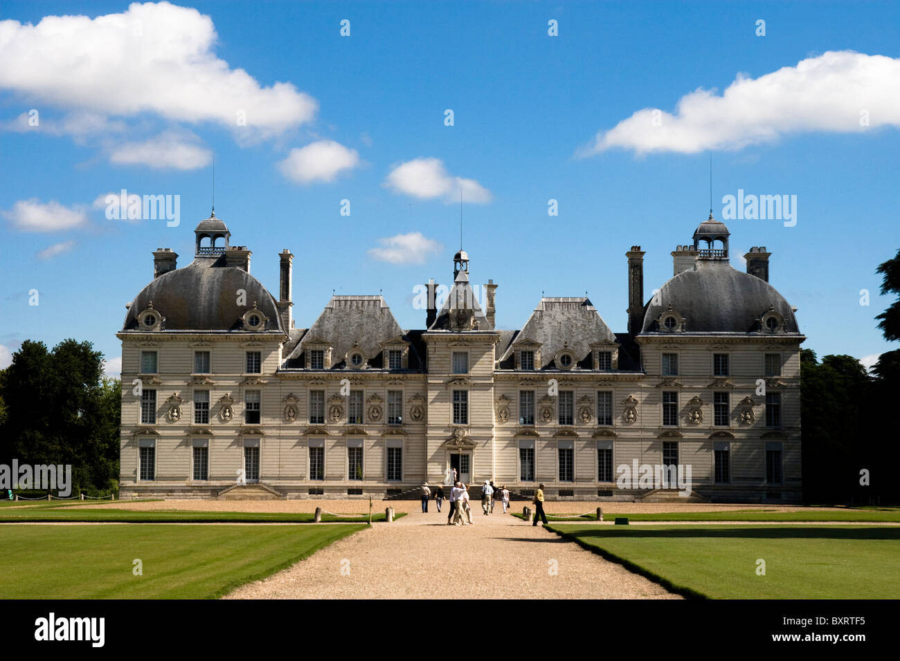 France, Loire, Cheverny, View of castle with people walking on avenue ...