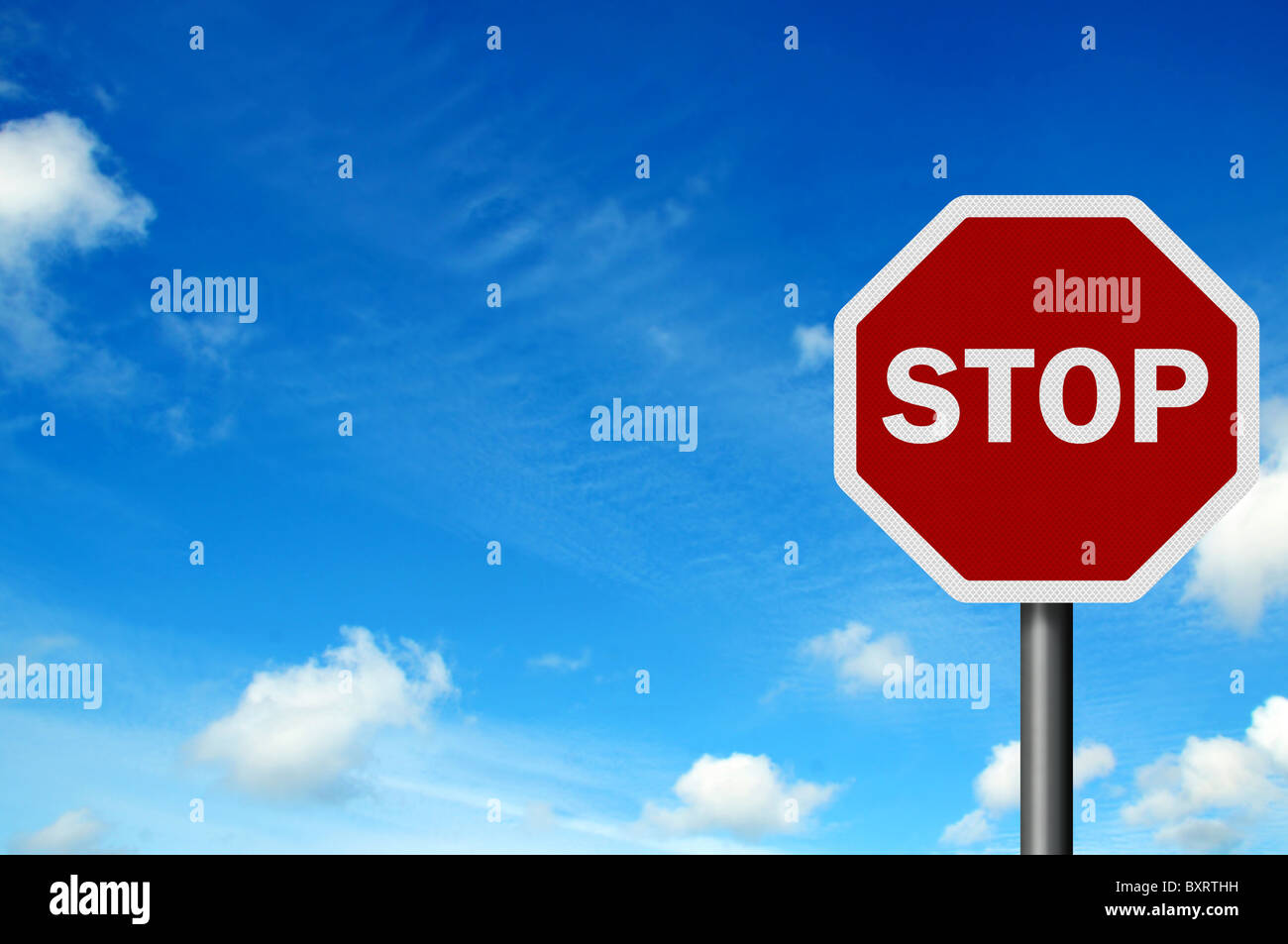 Photo realistic 'stop' sign against a bright blue sky Stock Photo