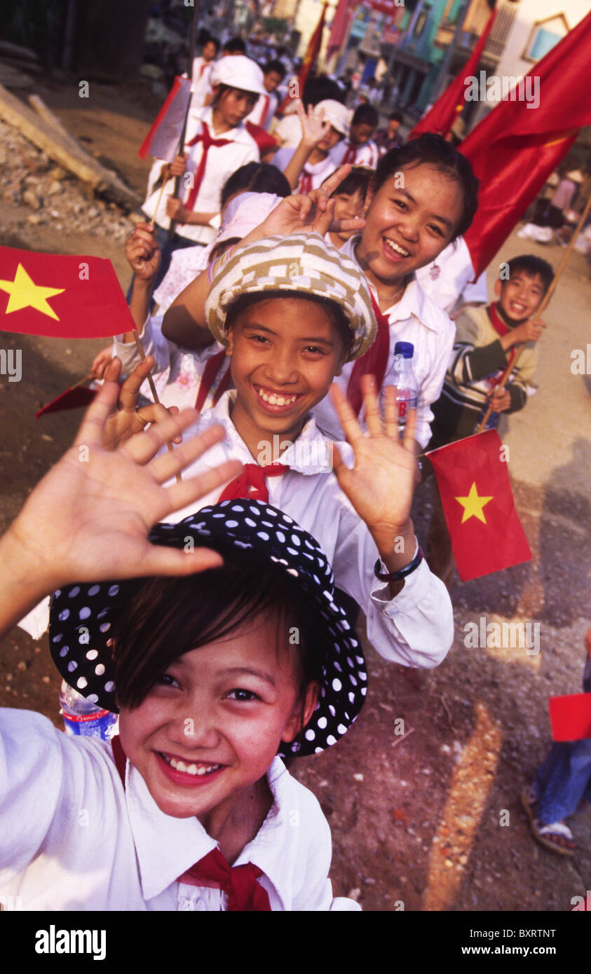 School children celebrating the 10th National Congress of the Communist Party of Vietnam (2006). Son La, Vietnam. Stock Photo