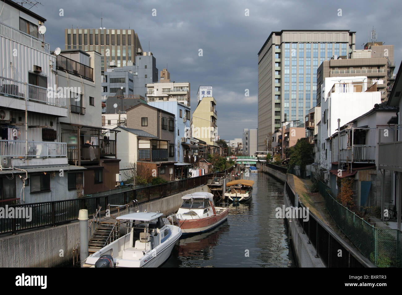 Housing property on a river canal in Tokyo Japan Stock Photo