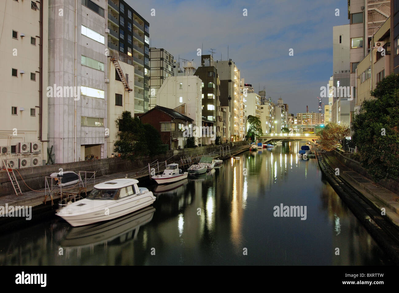 Housing property on a river canal in Tokyo Japan Stock Photo