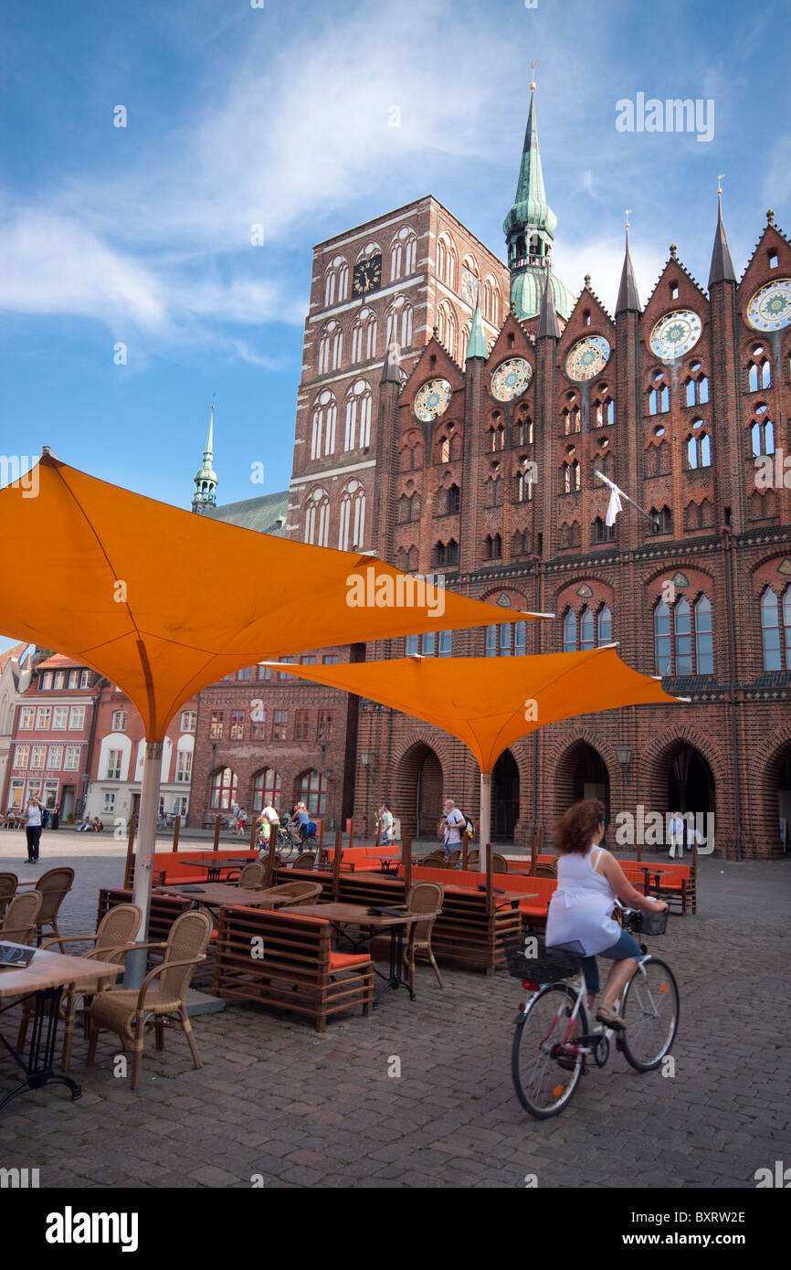Germany, Stralsund, town hall and pavement cafe Stock Photo