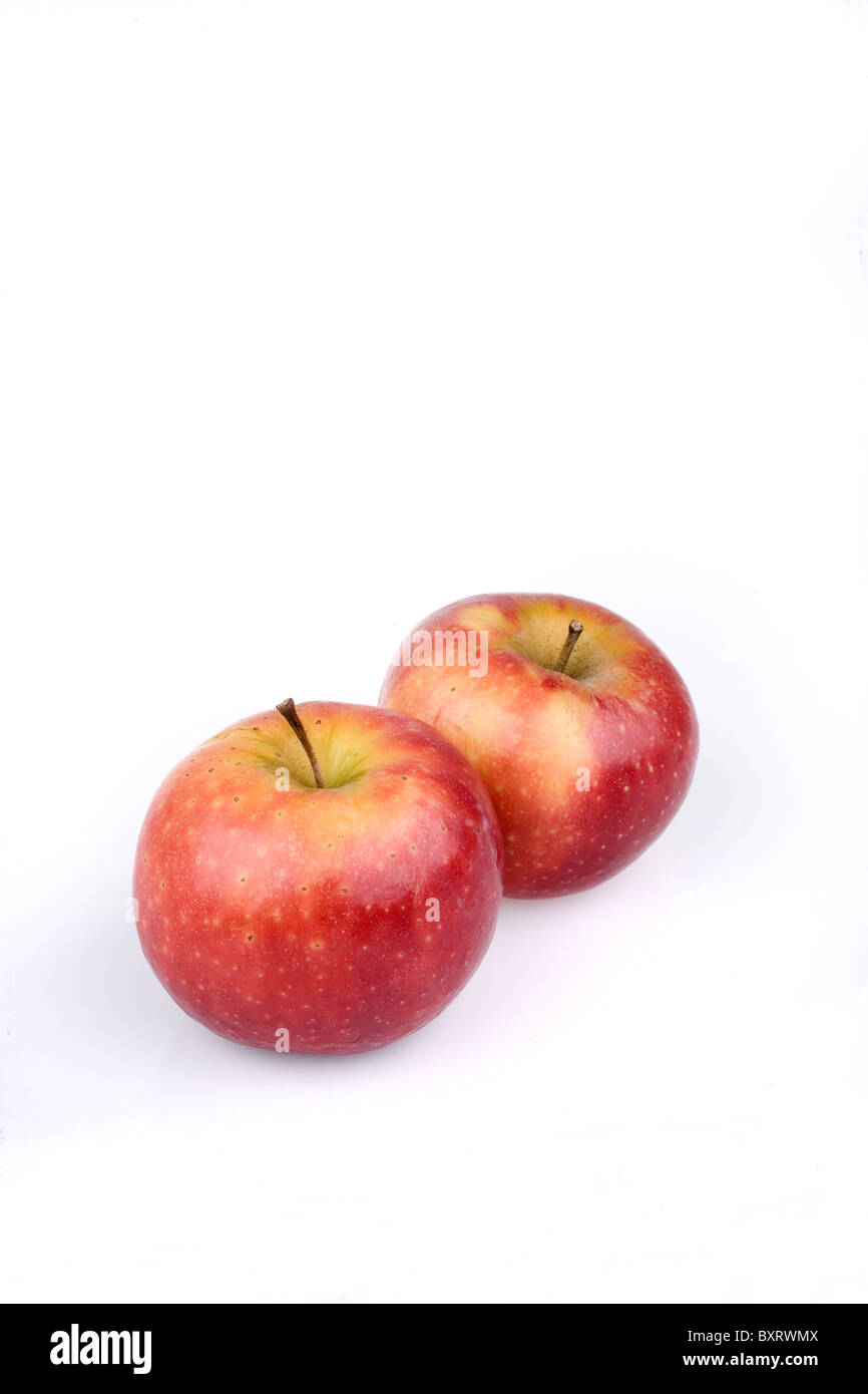 Two Ingrid Marie apples on white background Stock Photo Alamy