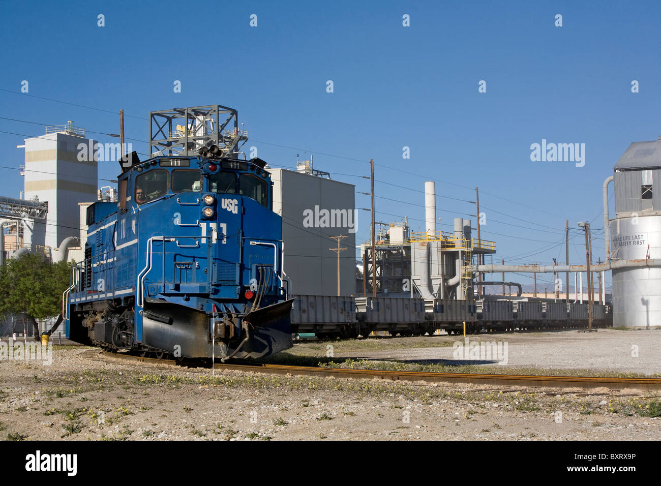 Plaster City mine train dumps a load of gypsum at the US Gypsum board plant in Southern California, west of El Centro, CA. USA Stock Photo