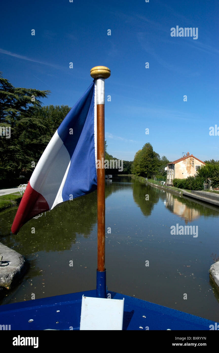 French Flag On Bow Of Barge On The Canal Du Centre Stock Photo