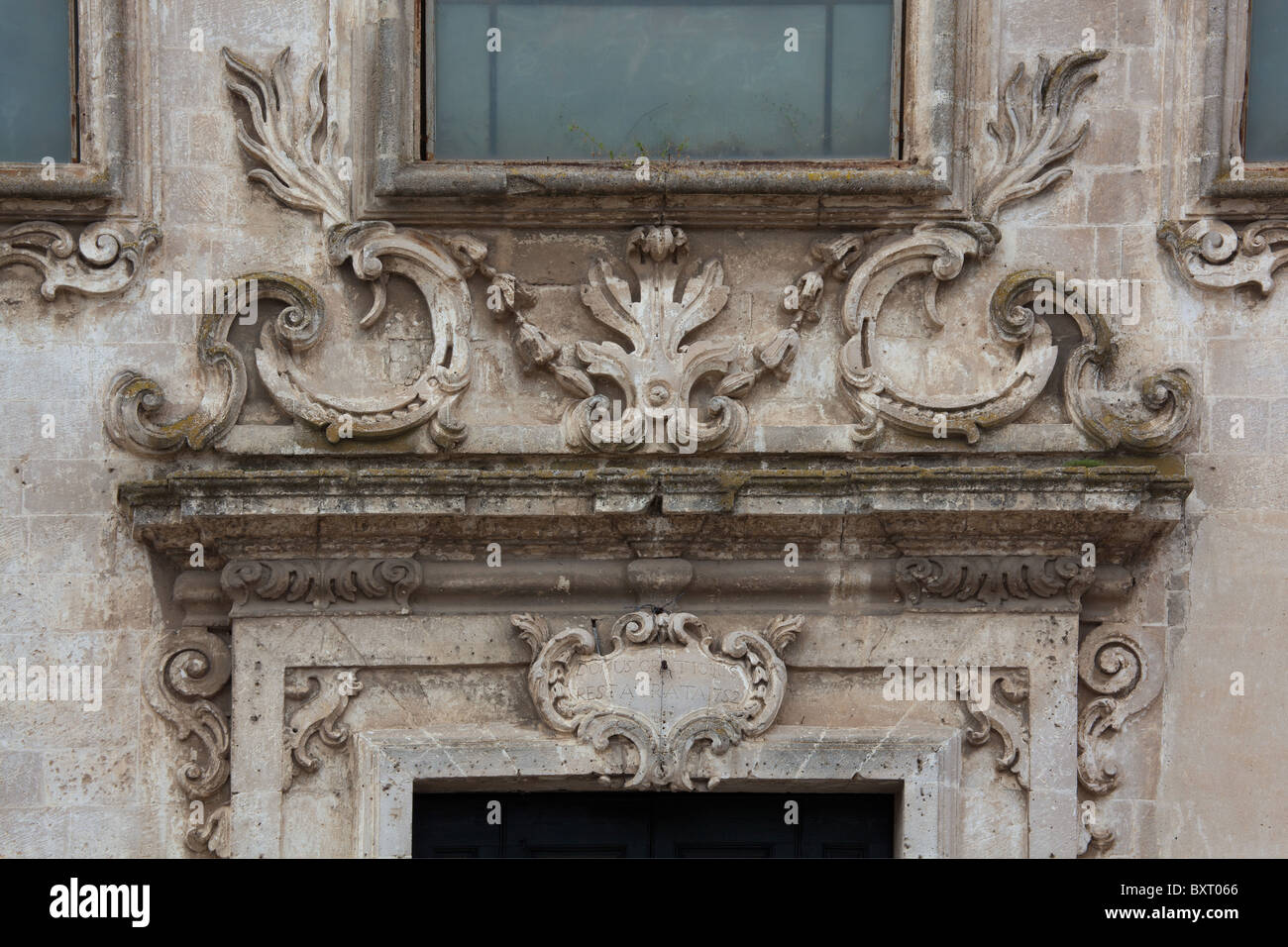 Friezes on the central portal, San Francesco d'Assisi church, Matera, Basilicata, Italy Stock Photo
