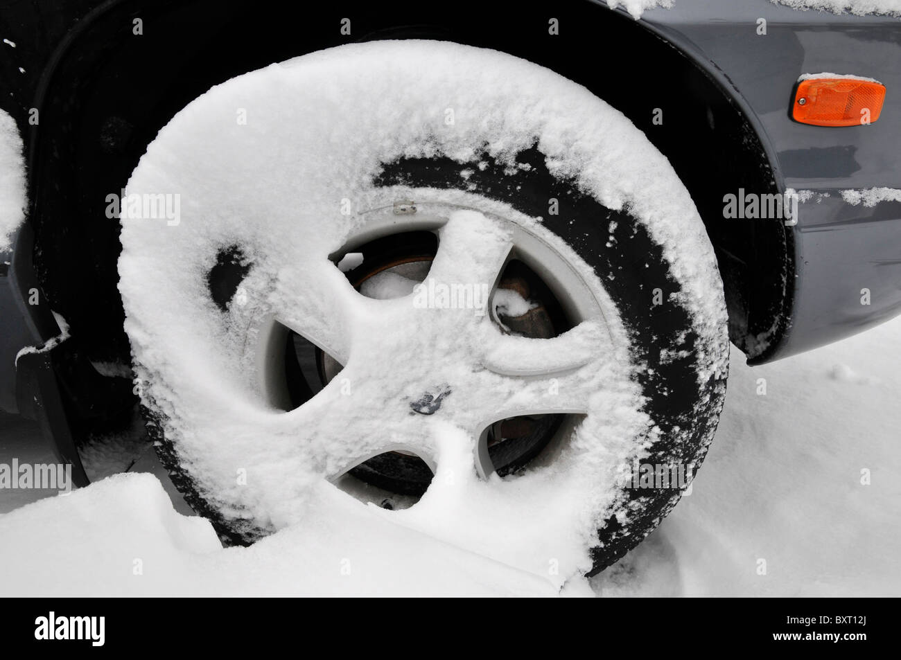 Car wheel in snow, Philadelphia, PA, USA Stock Photo