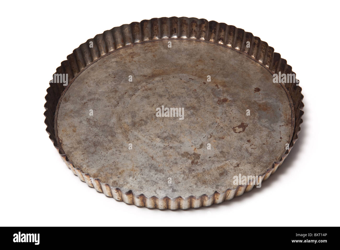 Flan baking tin isolated on a white studio background. Stock Photo