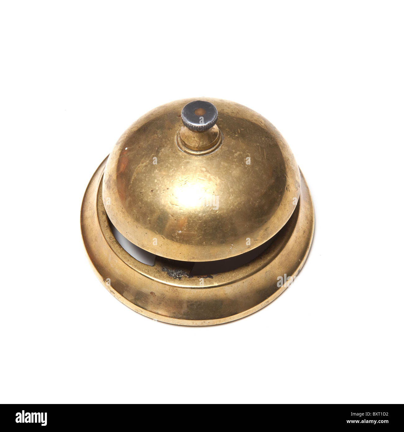Brass desk or hotel bell isolated on a white studio background. Stock Photo