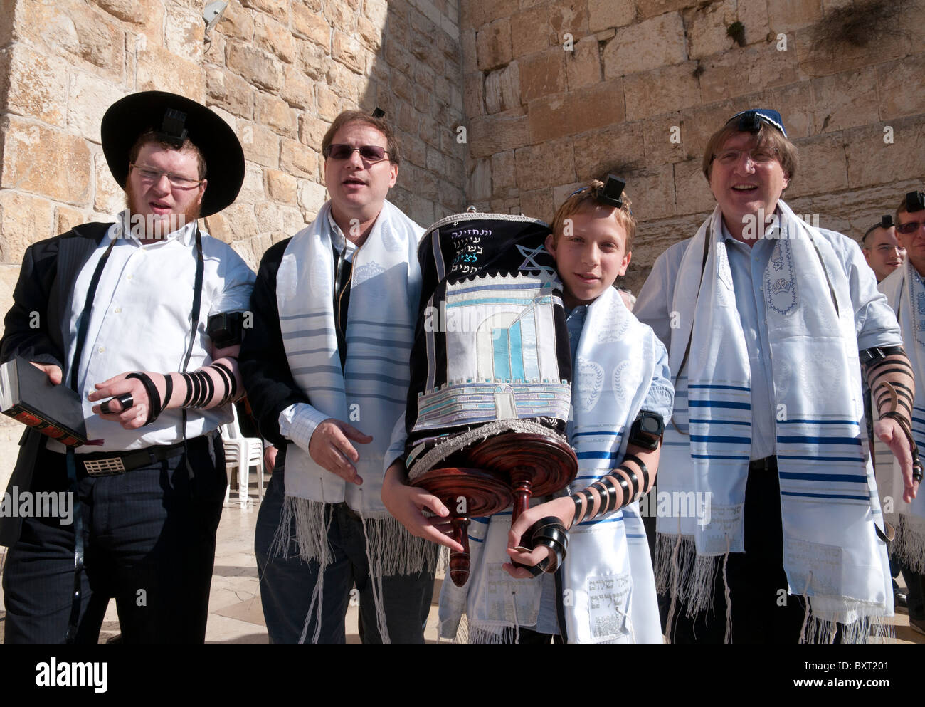 Western Wall. youngster carrying torah scrolls on his bar mitzvah