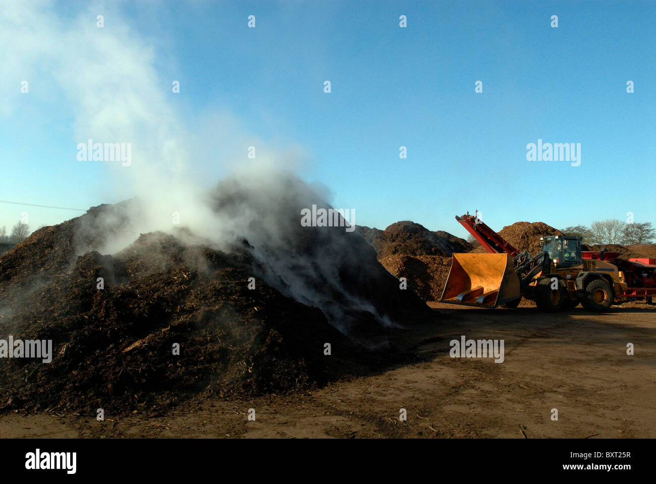 Green Waste Recycling Centre and digger UK Stock Photo Alamy