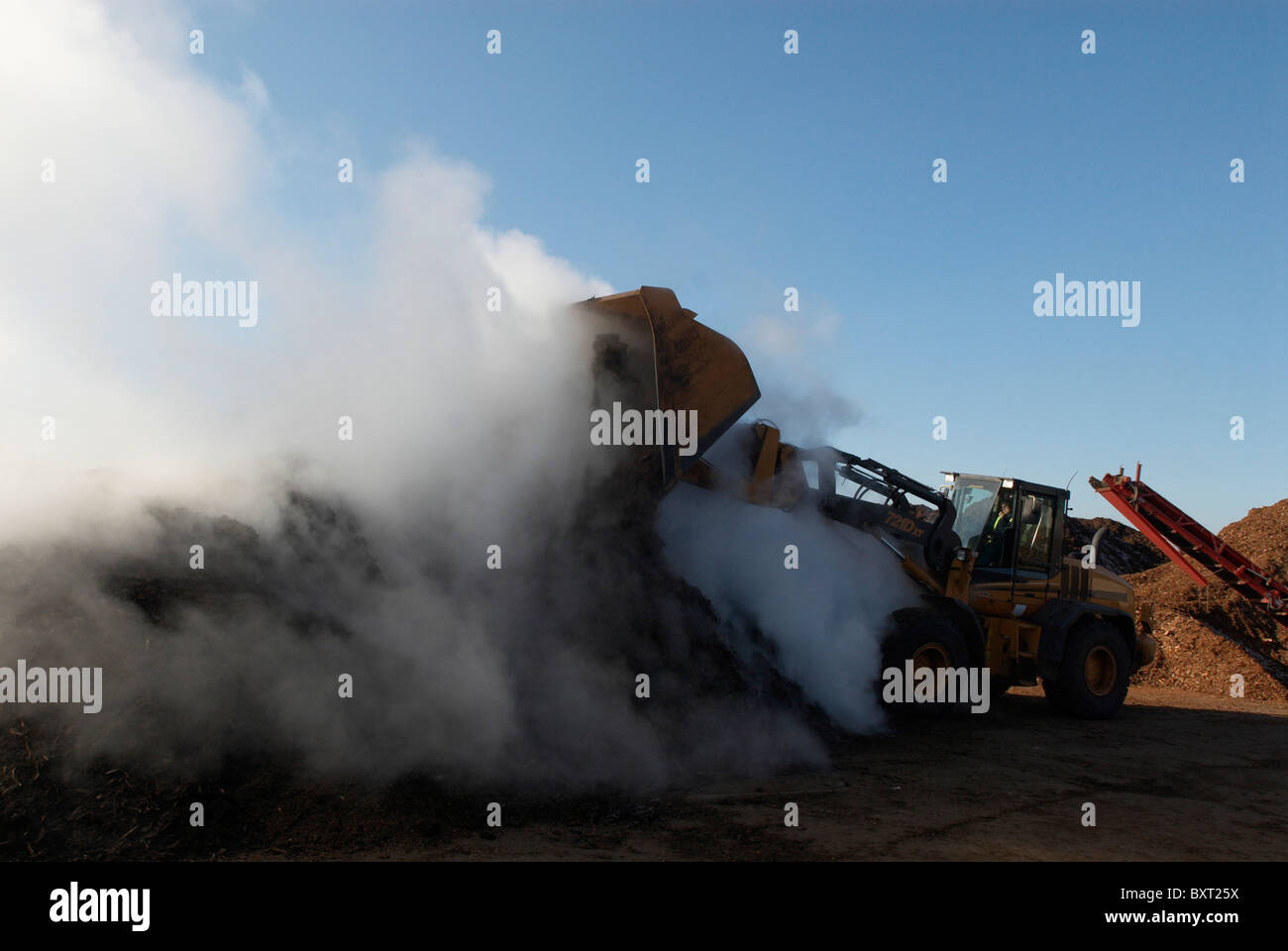Green Waste Recycling Centre and digger UK Stock Photo Alamy