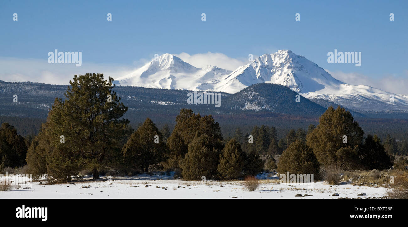 The Three Sisters peaks in the Oregon Cascade Mountains in winter near the city of Bend. Stock Photo