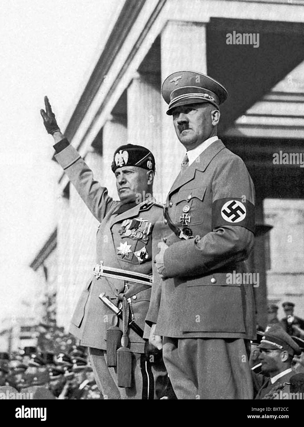 BENITO MUSSOLINI  takes a salute alongside Adolf Hitler in Munich in  1940 Stock Photo
