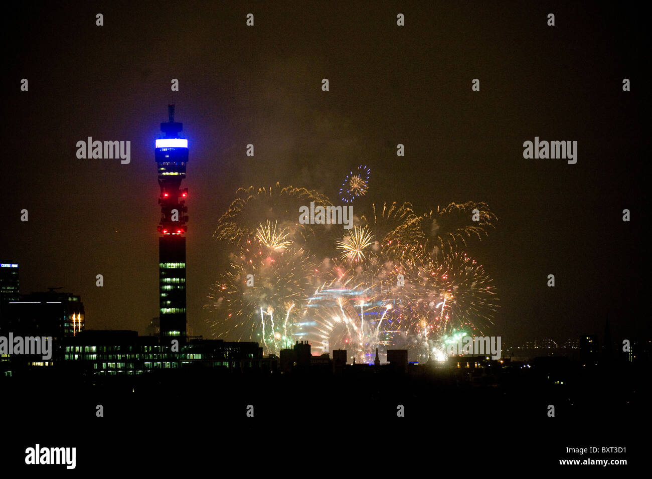 New Year's Eve London fireworks seen from Primrose Hill London with Telecom tower in foreground Stock Photo