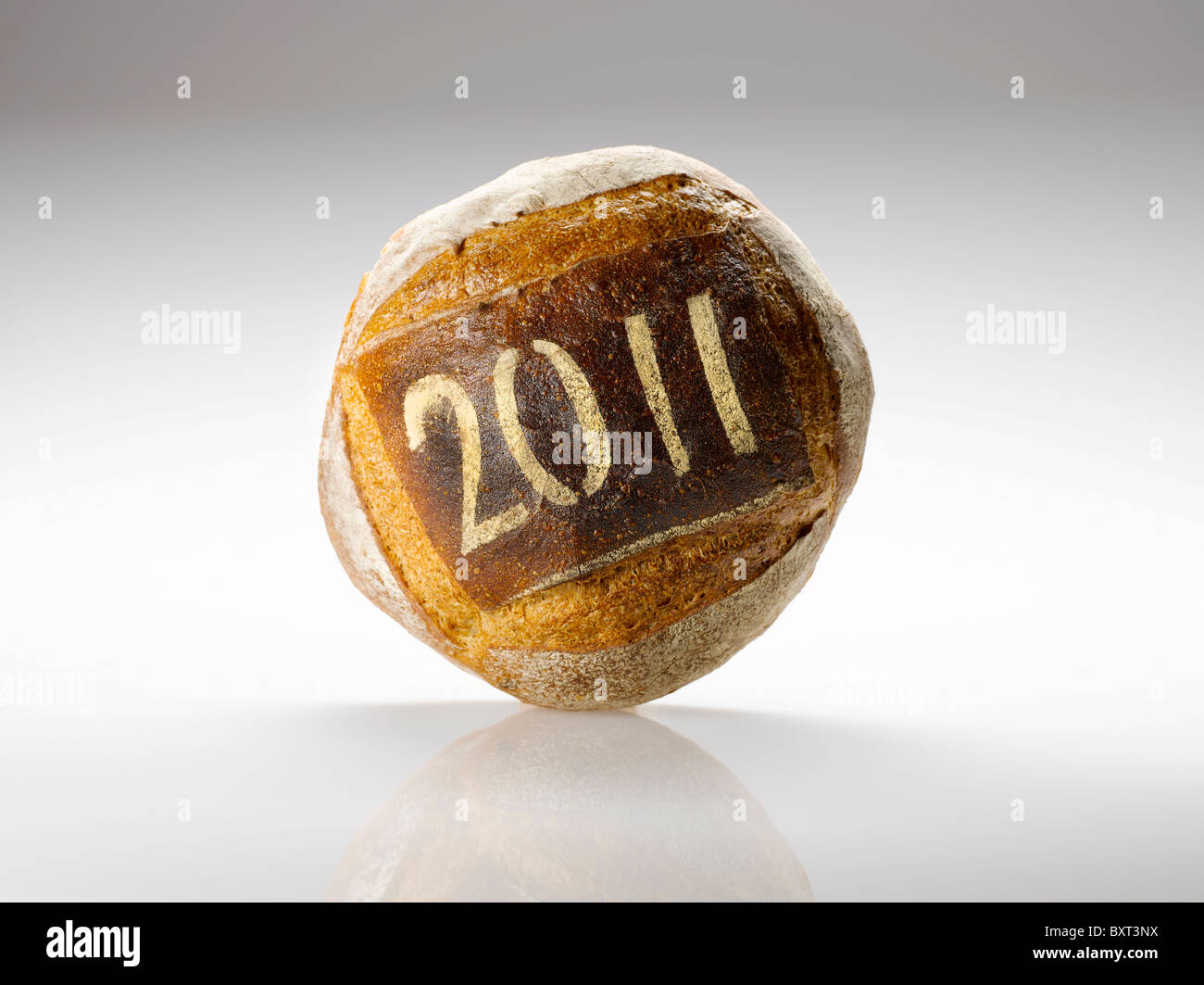 round loaf of bread dusted with the year 2011 Stock Photo