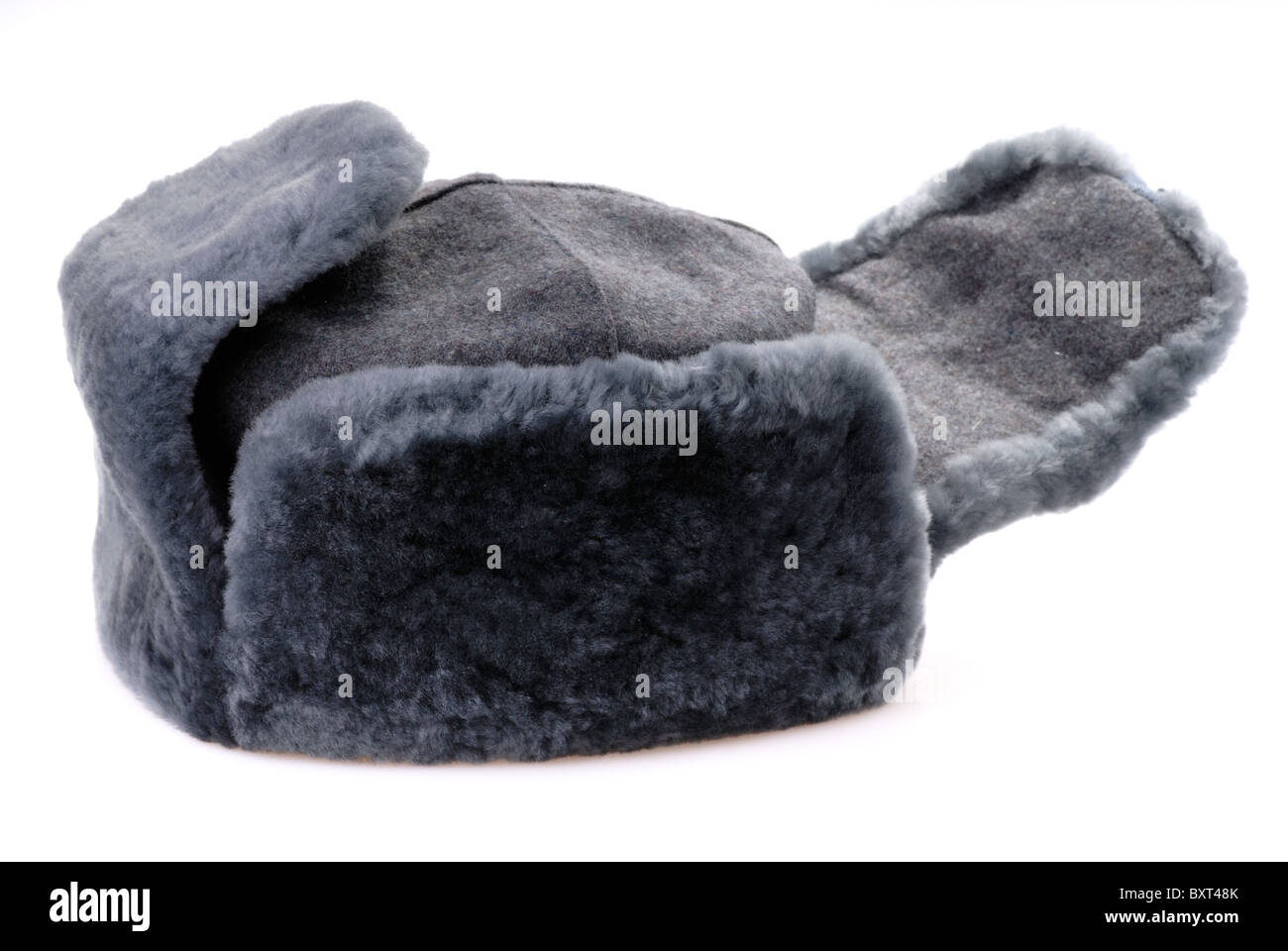Russian fur hat with ear-flaps isolated on white Stock Photo