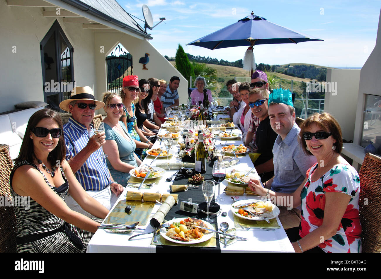 Family Christmas meal outdoors on terrace, Cashmere Hills, Christchurch, Canterbury, South Island, New Zealand Stock Photo