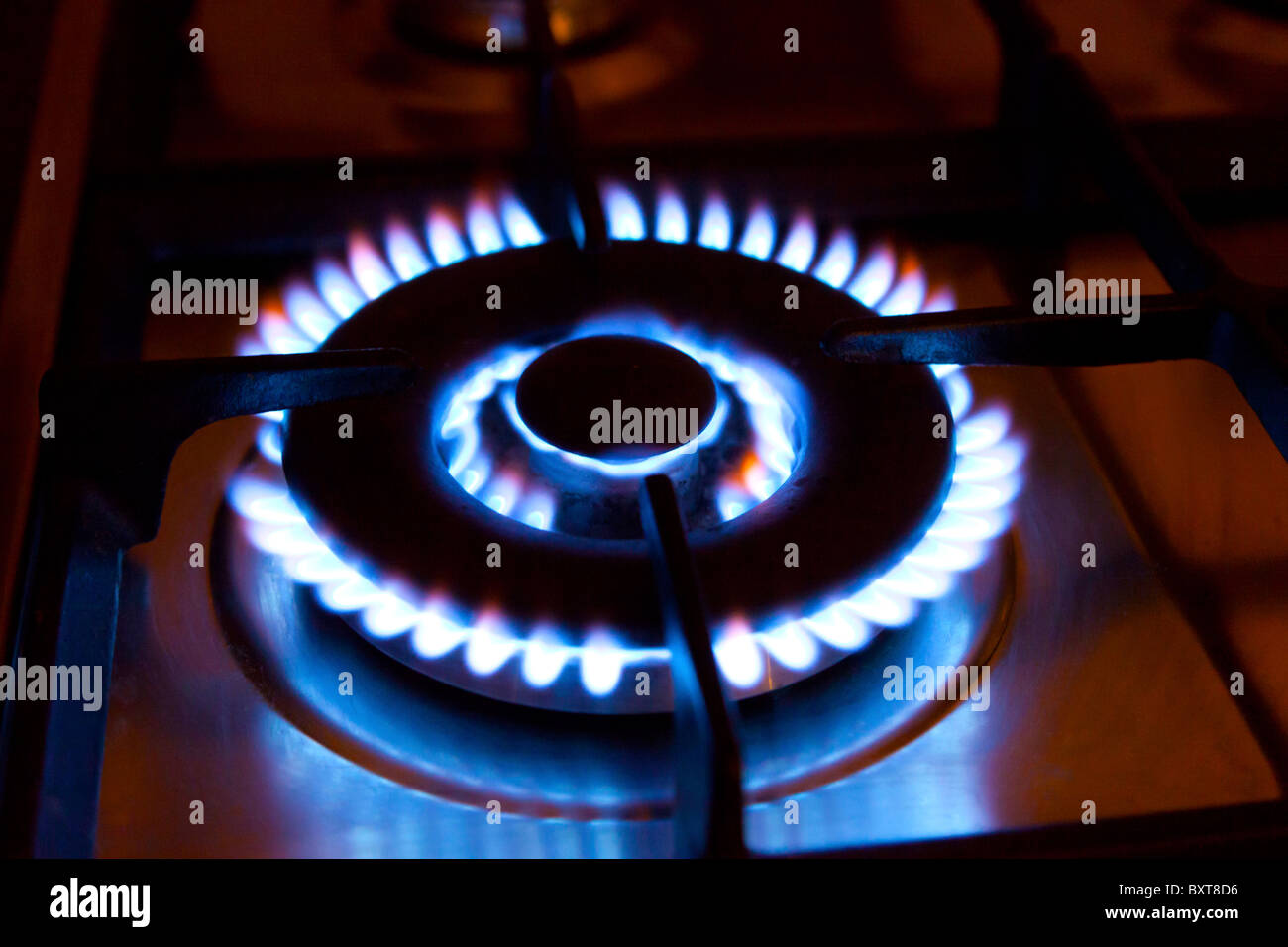 gas flames on cooker hob Stock Photo