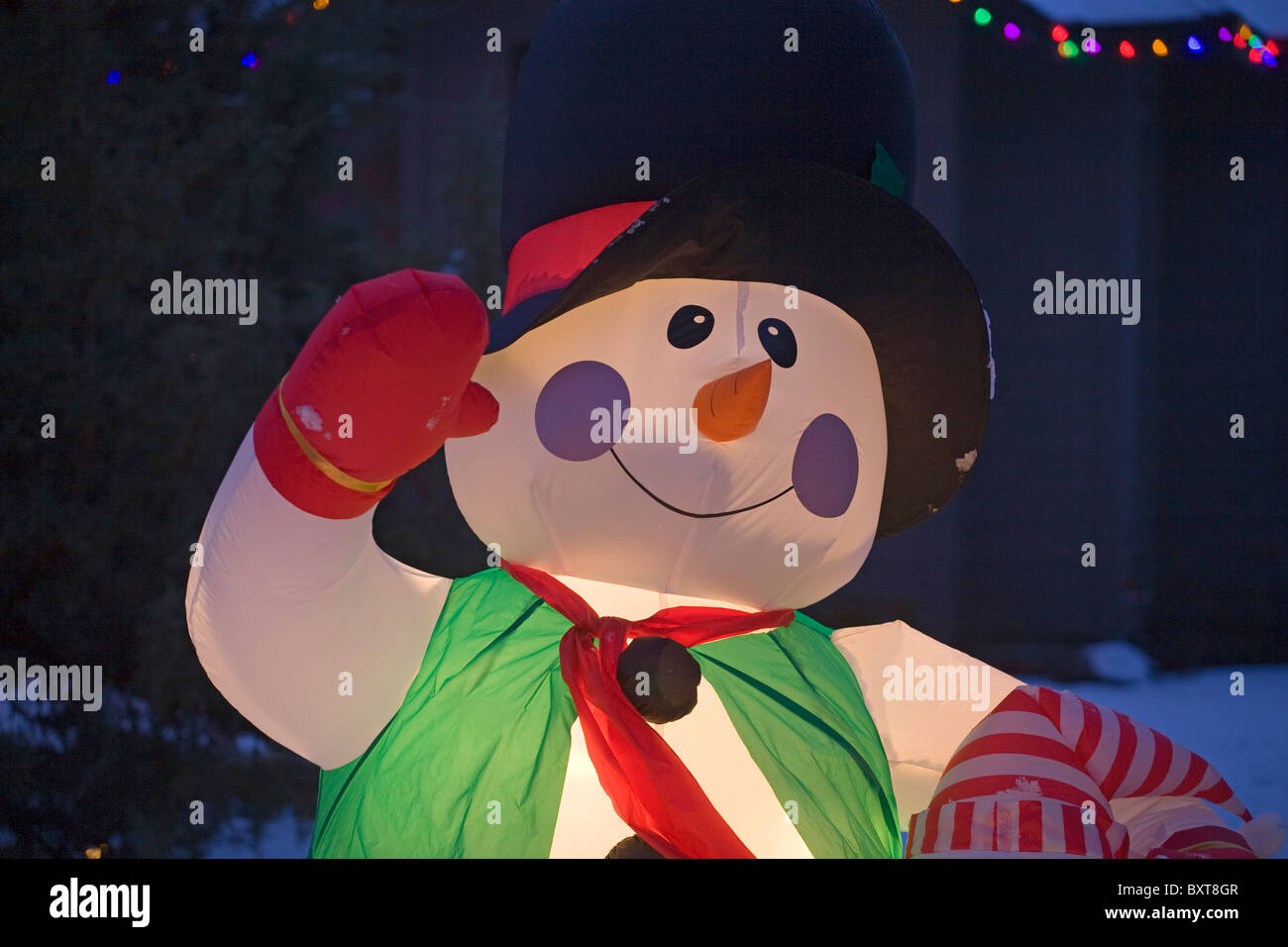 A snowman and Christmas lights at Christmas Stock Photo