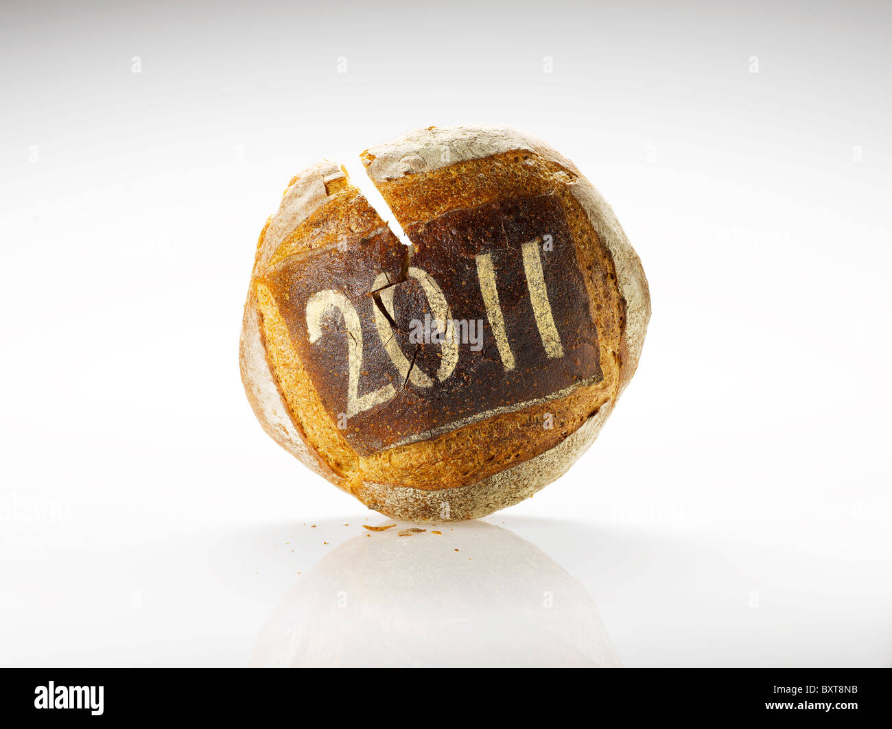 round loaf of bread dusted with the year date 2011 Stock Photo
