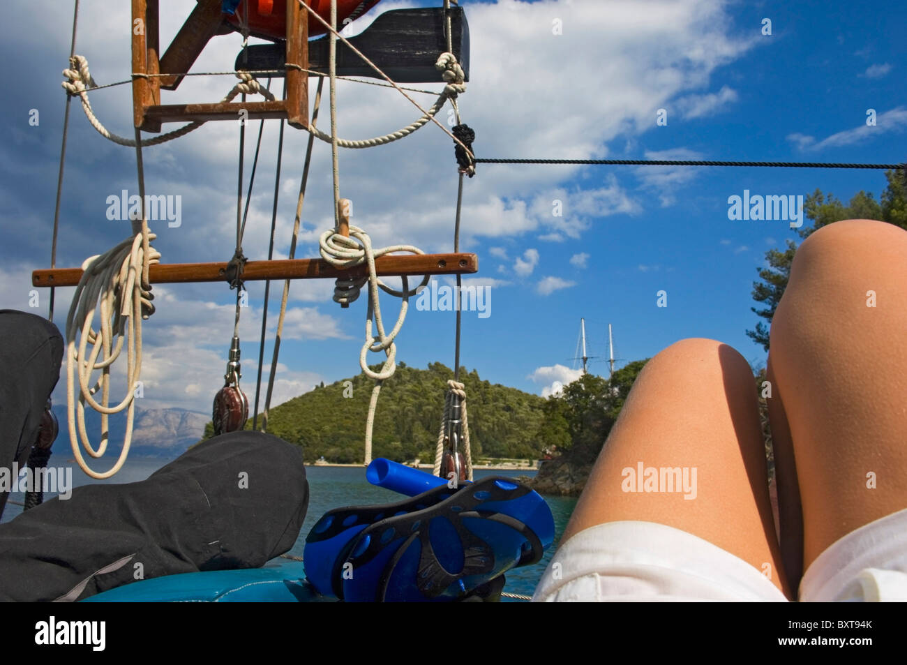 Couple Lying On Deck Of Yacht Sailing Near The Island Lefkas Stock ...
