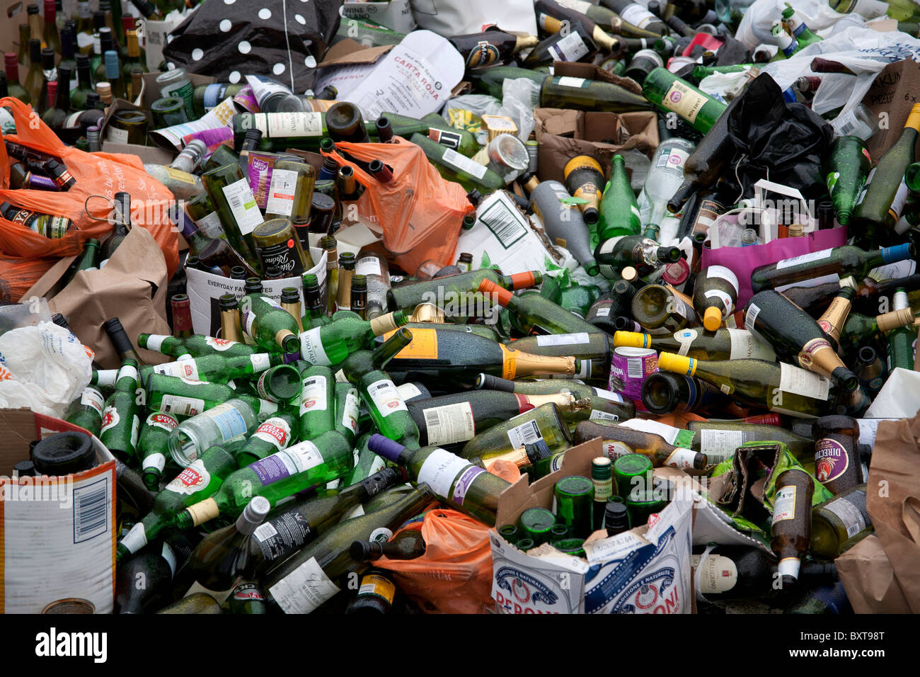 Overflow of uncollected bottles after Christmas Sainsbury's Car Park recycling depot, Chiswick, London W4 Stock Photo