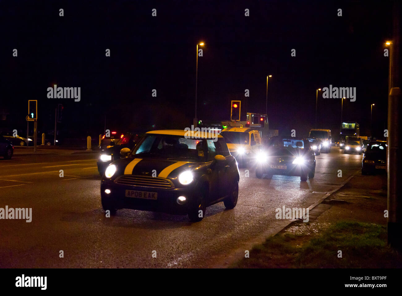 busy road at night in UK Stock Photo