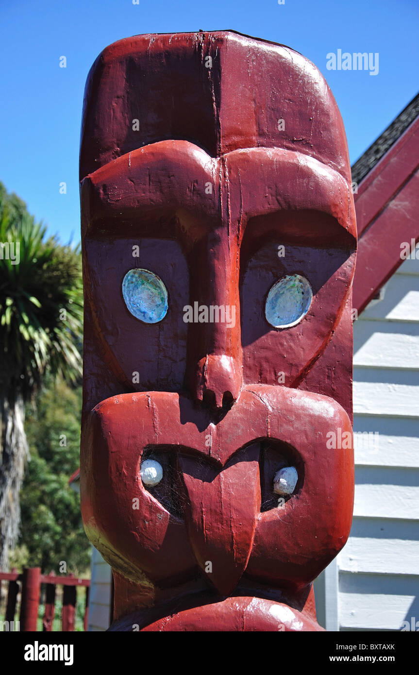 Maori carving outside Onuku Church, Onuku, near Akaroa, Akaroa Harbour, Banks Peninsula, Canterbury Region, New Zealand Stock Photo
