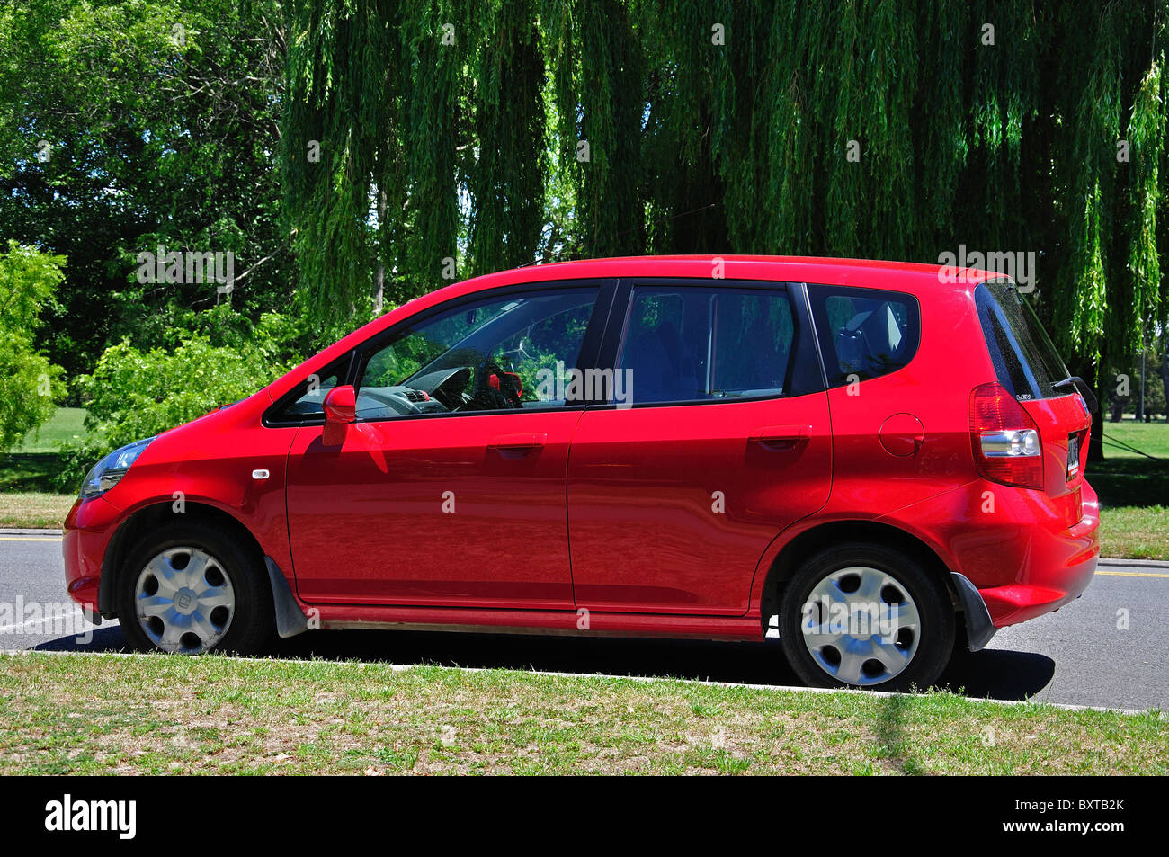 Red Honda Jazz car, Park Terrace, Christchurch, Canterbury Region, South Island, New Zealand Stock Photo