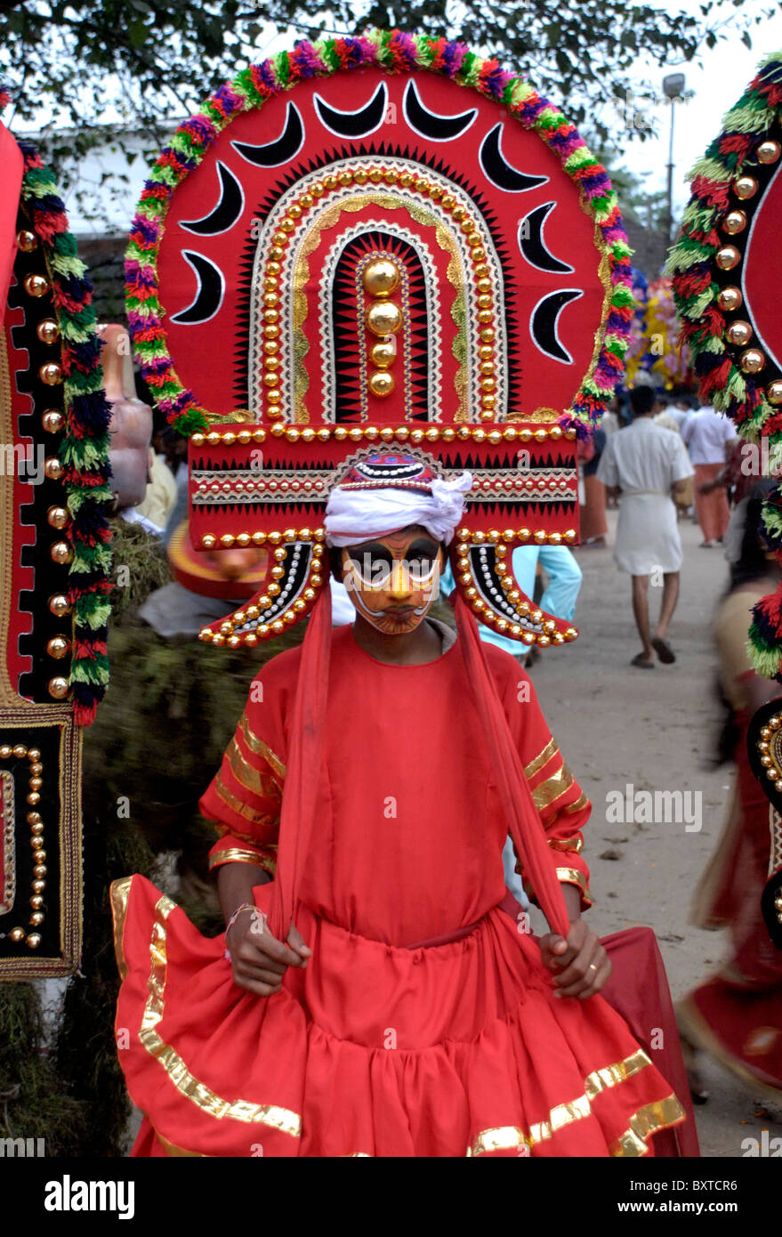 traditional theyyam dancer with colourful costumes from a festival in
