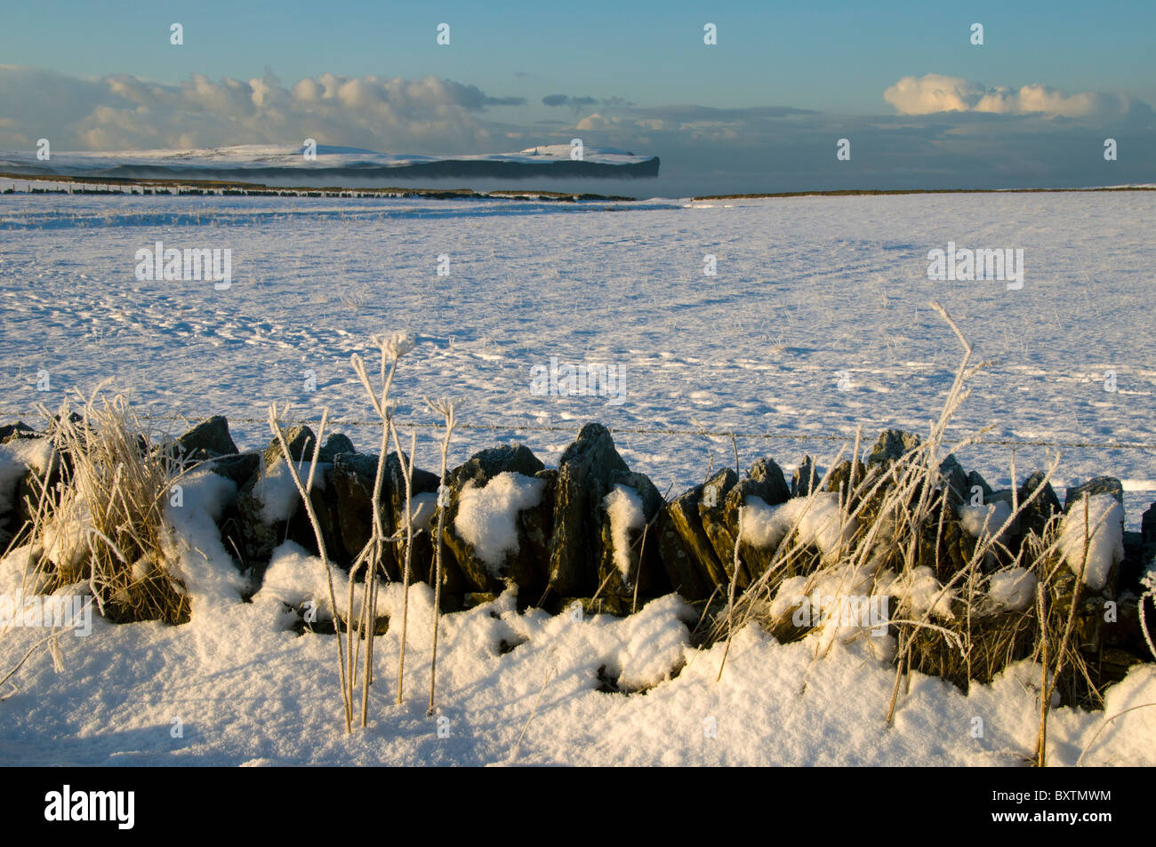 Dunnet Head over snow covered fields near Scarfskerry, Caithness, Scotland, UK Stock Photo
