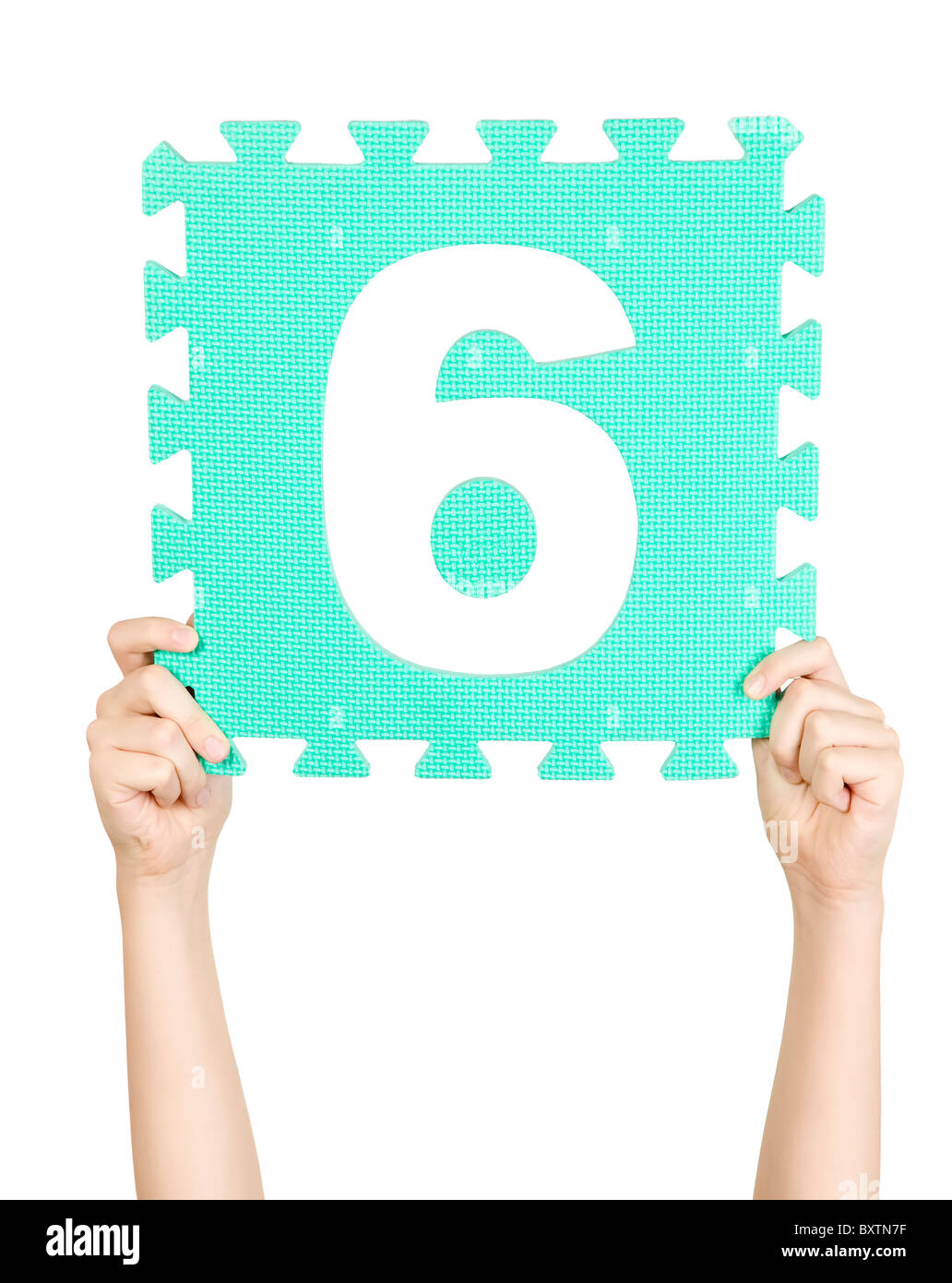 Child is holding number six in his hand Stock Photo