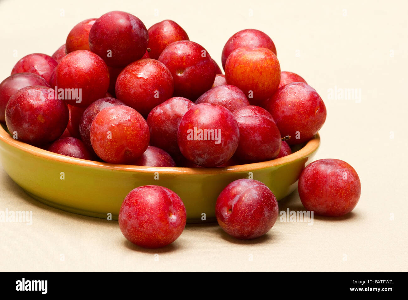 Fresh plums in a ceramic bowl Stock Photo