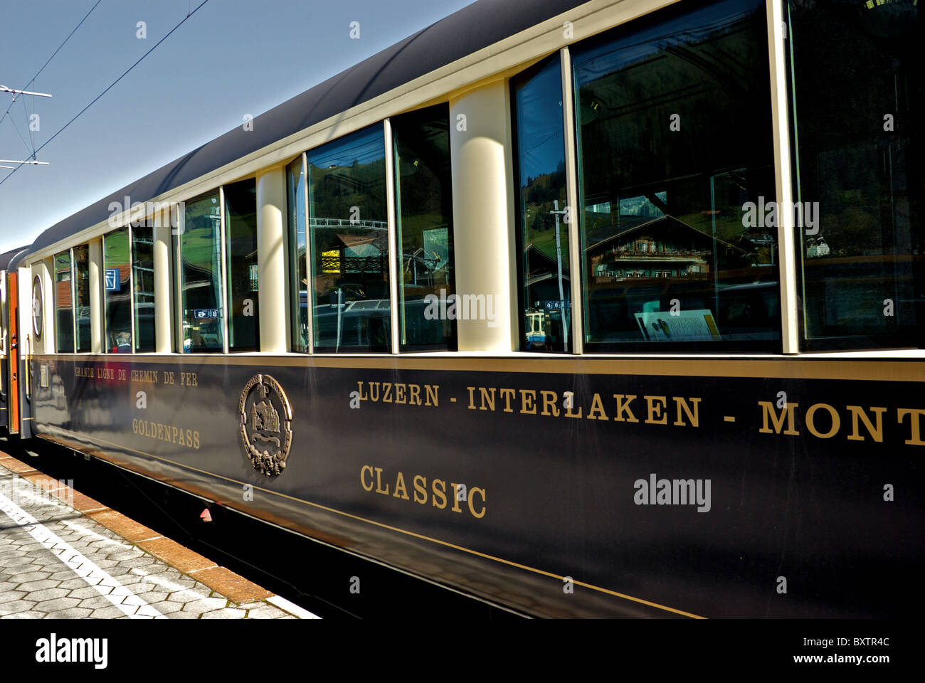 Golden Pass Classic Express train vintage rail car at Montreux Valais Switzerland railway station platform Stock Photo