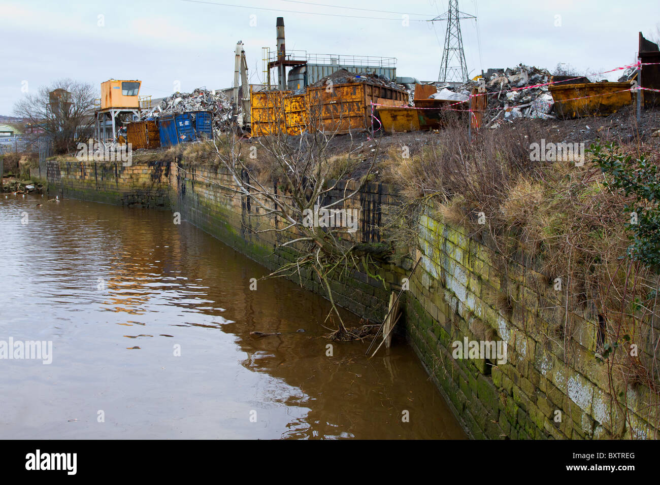 Riverside Scrapyard next to river tyne at Blaydon, North East England. Stock Photo