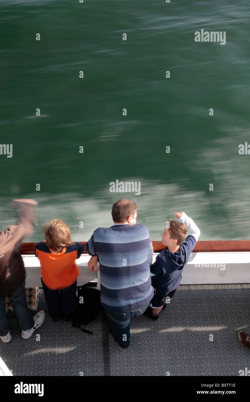 A blurry view of passengers looking over the side of a passenger ferry, (Norflokline ferry Dover to Dunkerque) Stock Photo