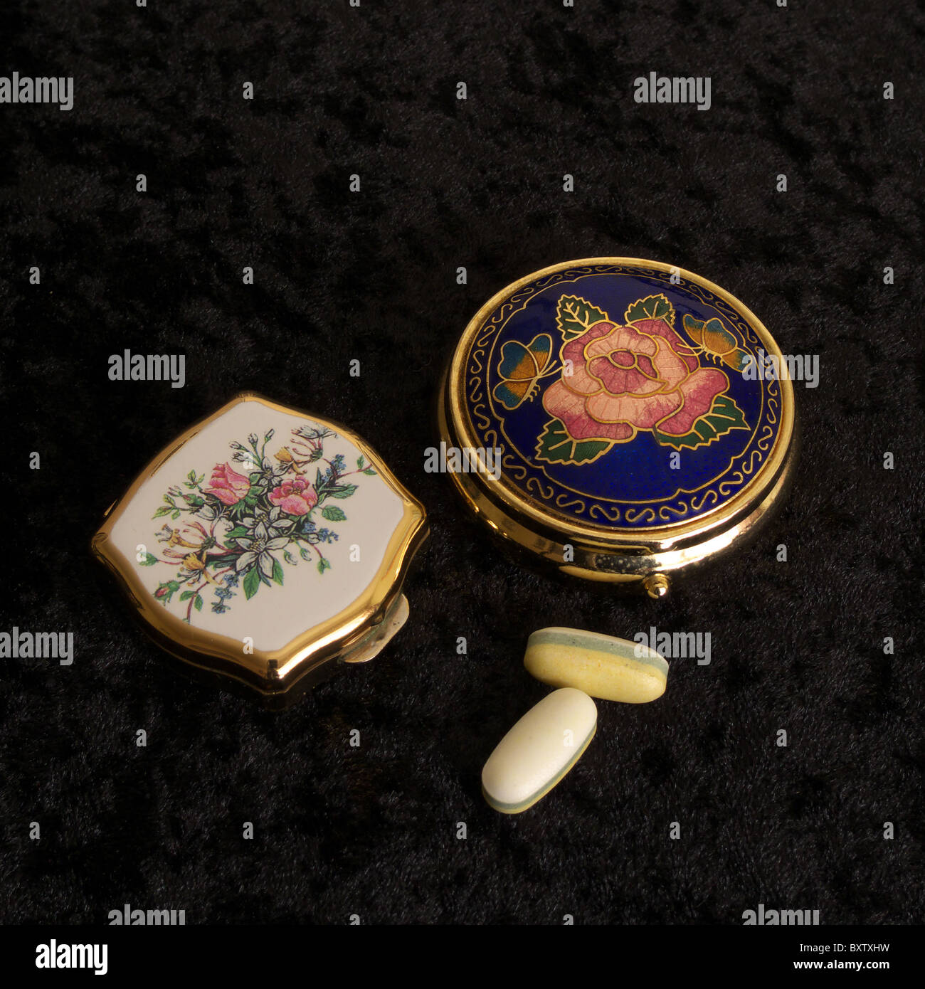 Two Womens Decorative Pill Boxes on a Black Velvet Background, UK Stock