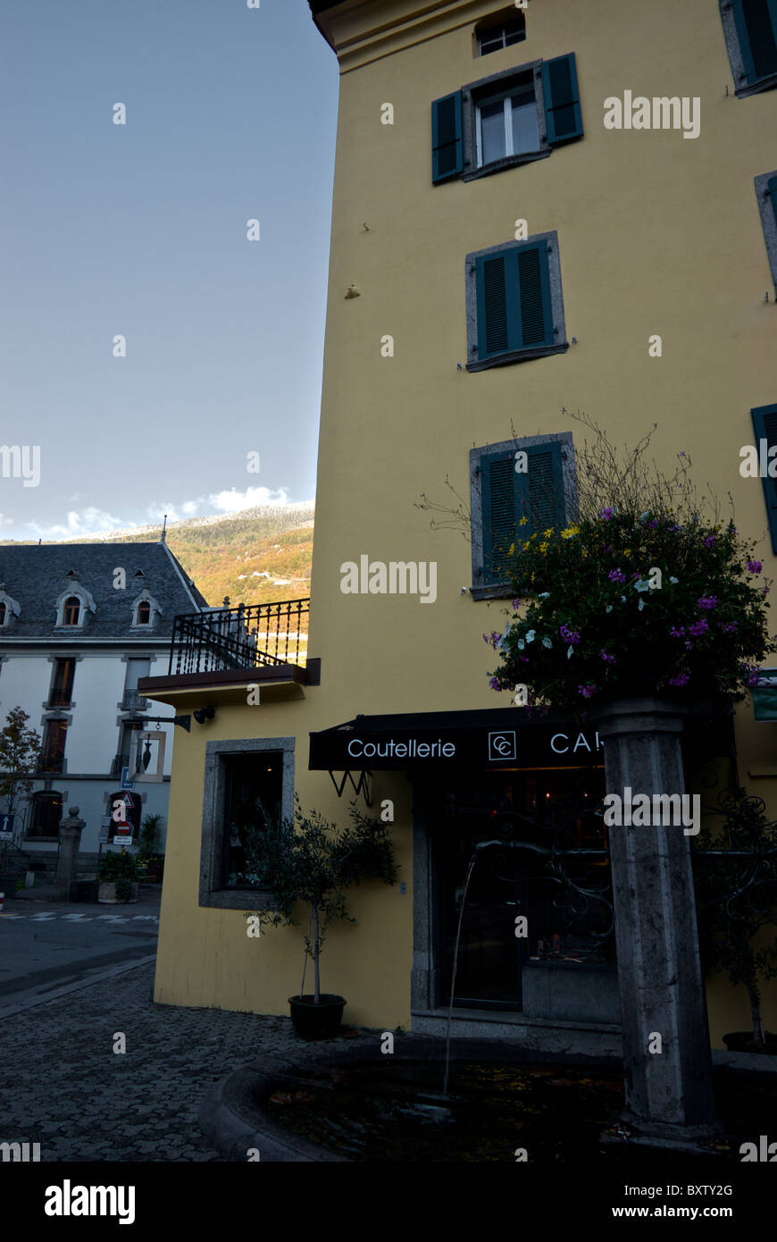 Cream pastel coloured residential apartment building Martigny Valais Switzerland Stock Photo