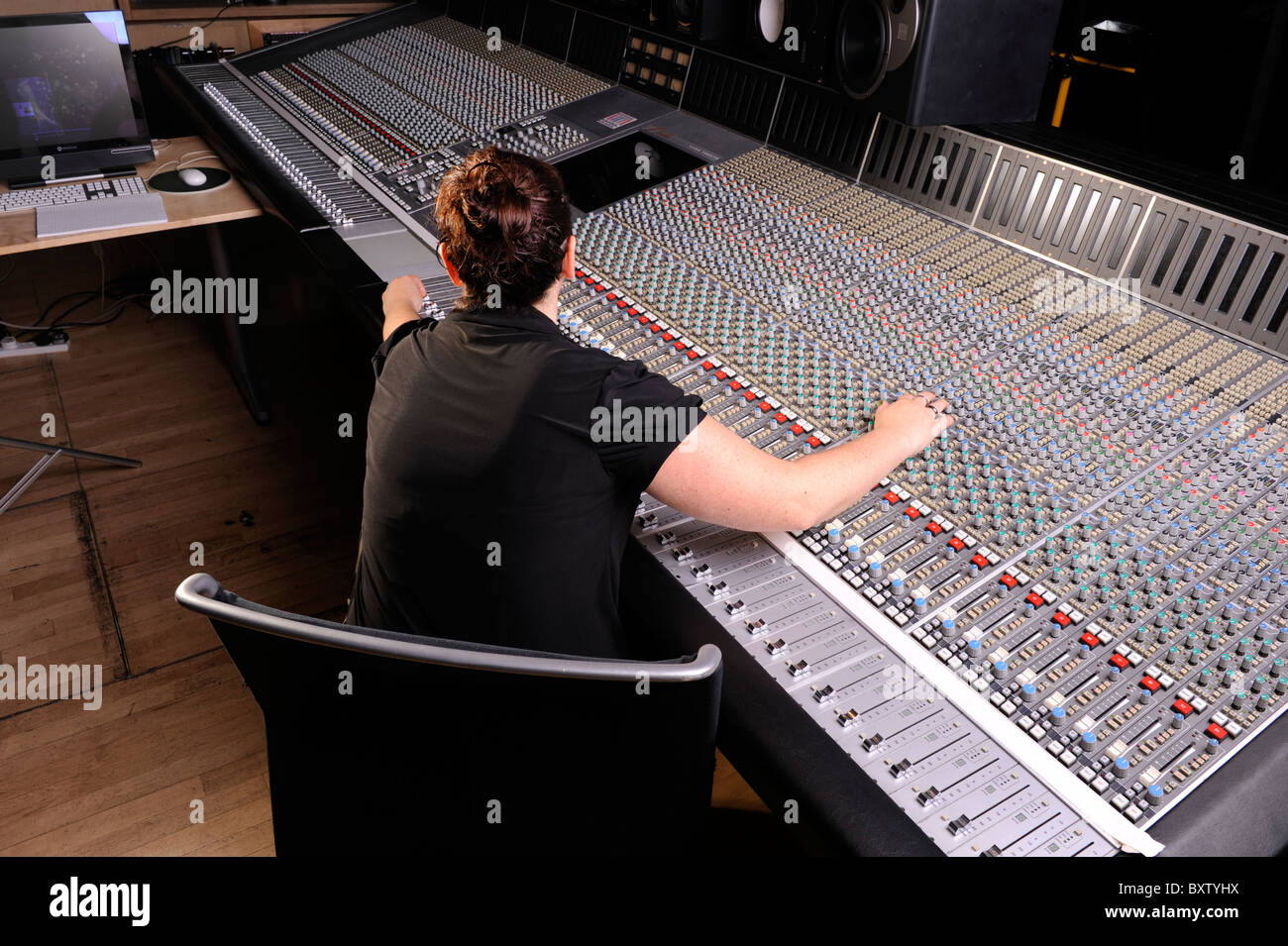 Large Mixing Desk In London Recording Studio With Sound Engineer
